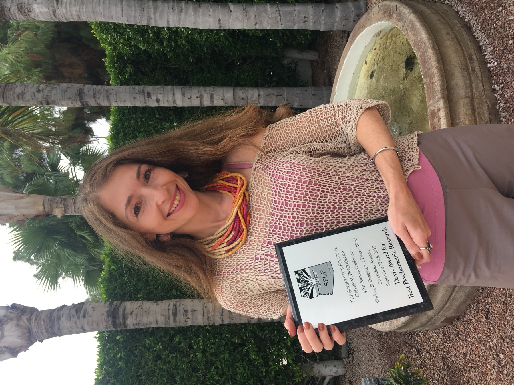 Dr. Marina Sorochinski holding the Davis Award for Best Psychometric Research, Society for Police and Criminal Psychology 45th Annual Conference, Scottsdale, Arizona, 2019